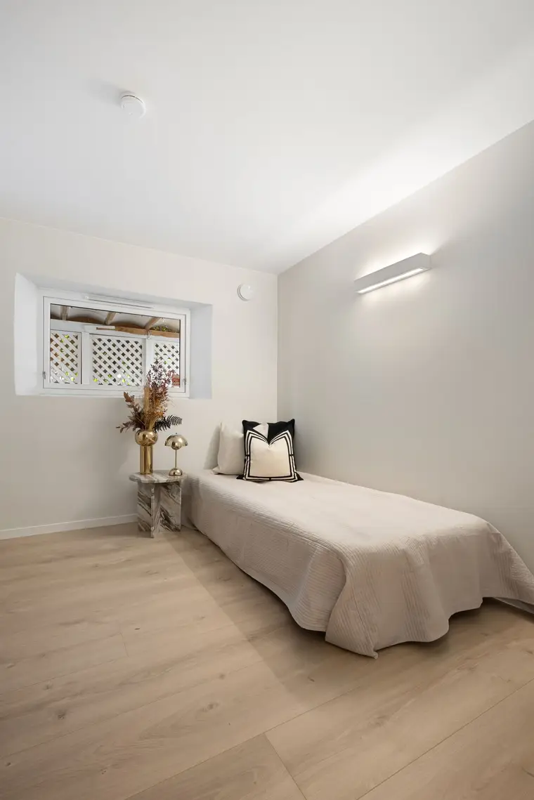Bright laminate flooring in a bedroom