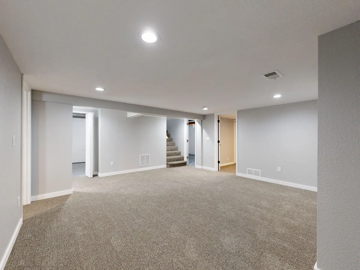 Spacious carpet flooring in a basement